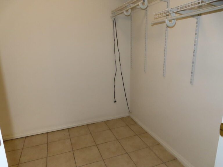 1325 N Third St - Master Bedroom walk-in closet with light brown tile floor